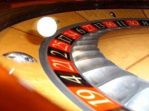 Ball spinning around roulette wheel